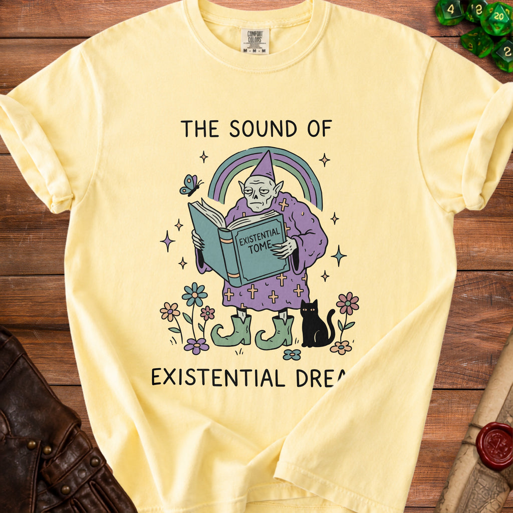 Yellow t-shirt with illustration of a wizard reading an "Existential Tome" and text "The Sound of Existential Dream".