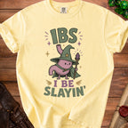 Light yellow t-shirt with wizard stomach graphic and text "IBS I BE SLAYIN'".