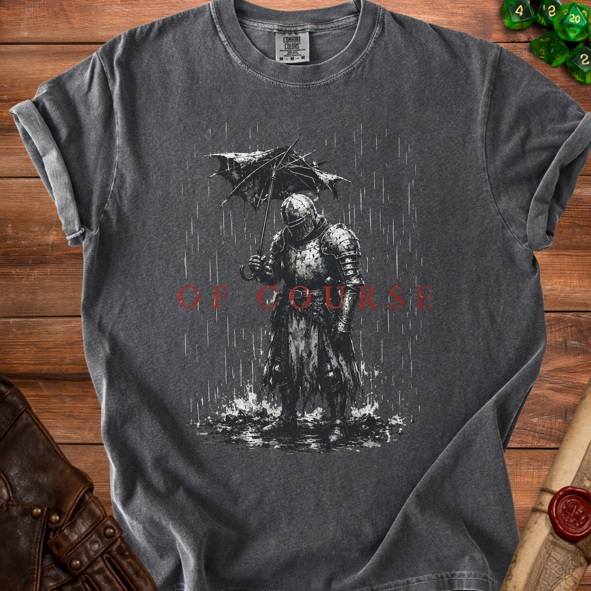 Dark grey t-shirt graphic of knight in armor holding umbrella in rain with text "OF COURSE".