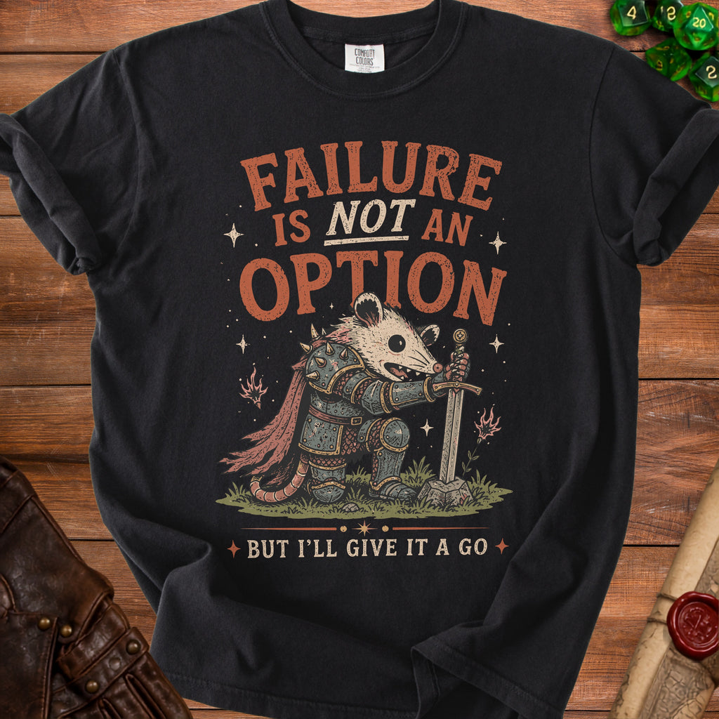 Black t-shirt with a knightly possum holding a sword, saying "Failure is not an option but I'll give it a go".