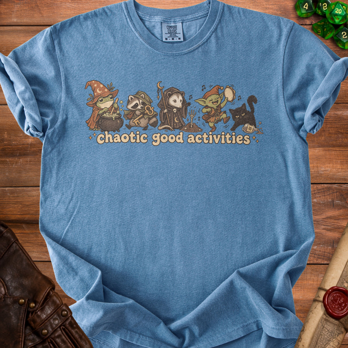 Blue t-shirt with a graphic of fantasy creatures and the text "chaotic good activities".