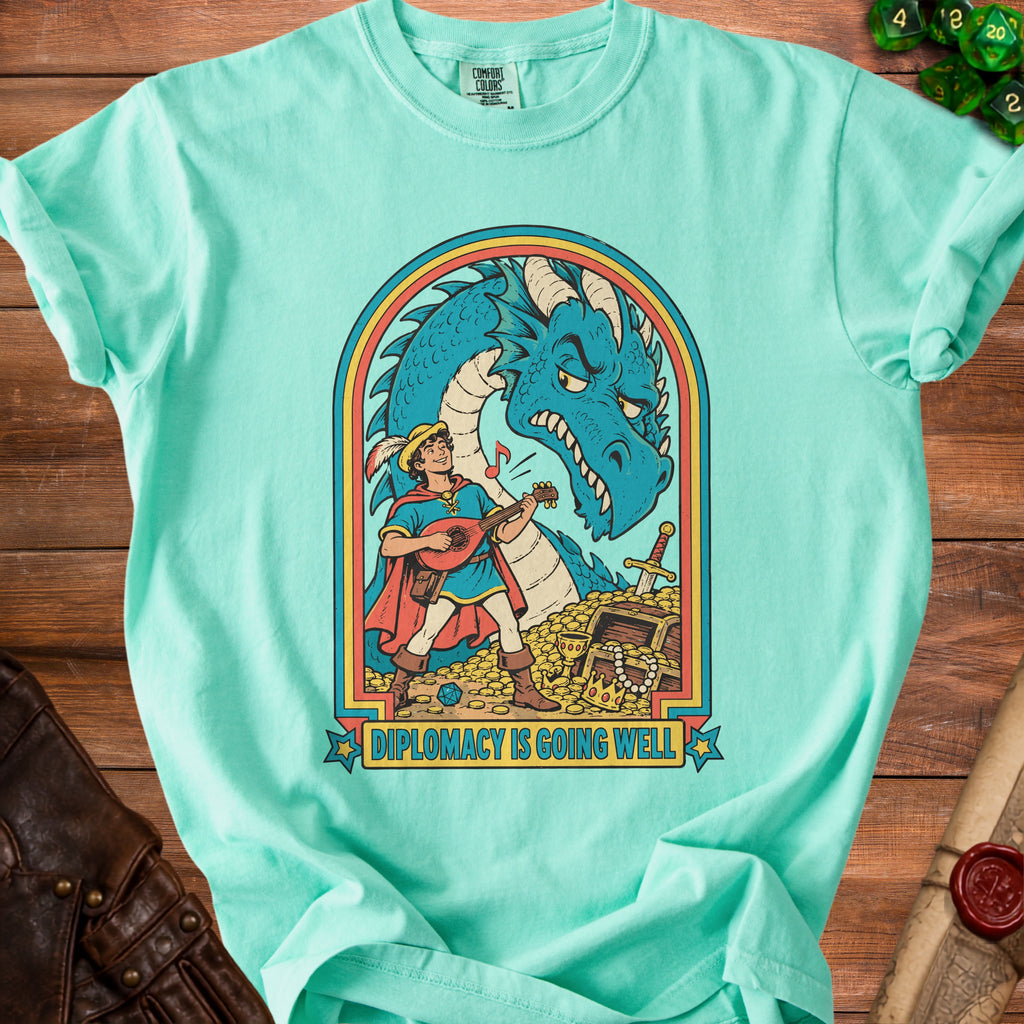 Mint t-shirt with a blue dragon and a lute-playing bard; "DIPLOMACY IS GOING WELL" text.