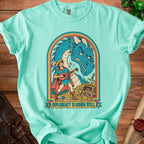 Mint t-shirt with a blue dragon and a lute-playing bard; "DIPLOMACY IS GOING WELL" text.