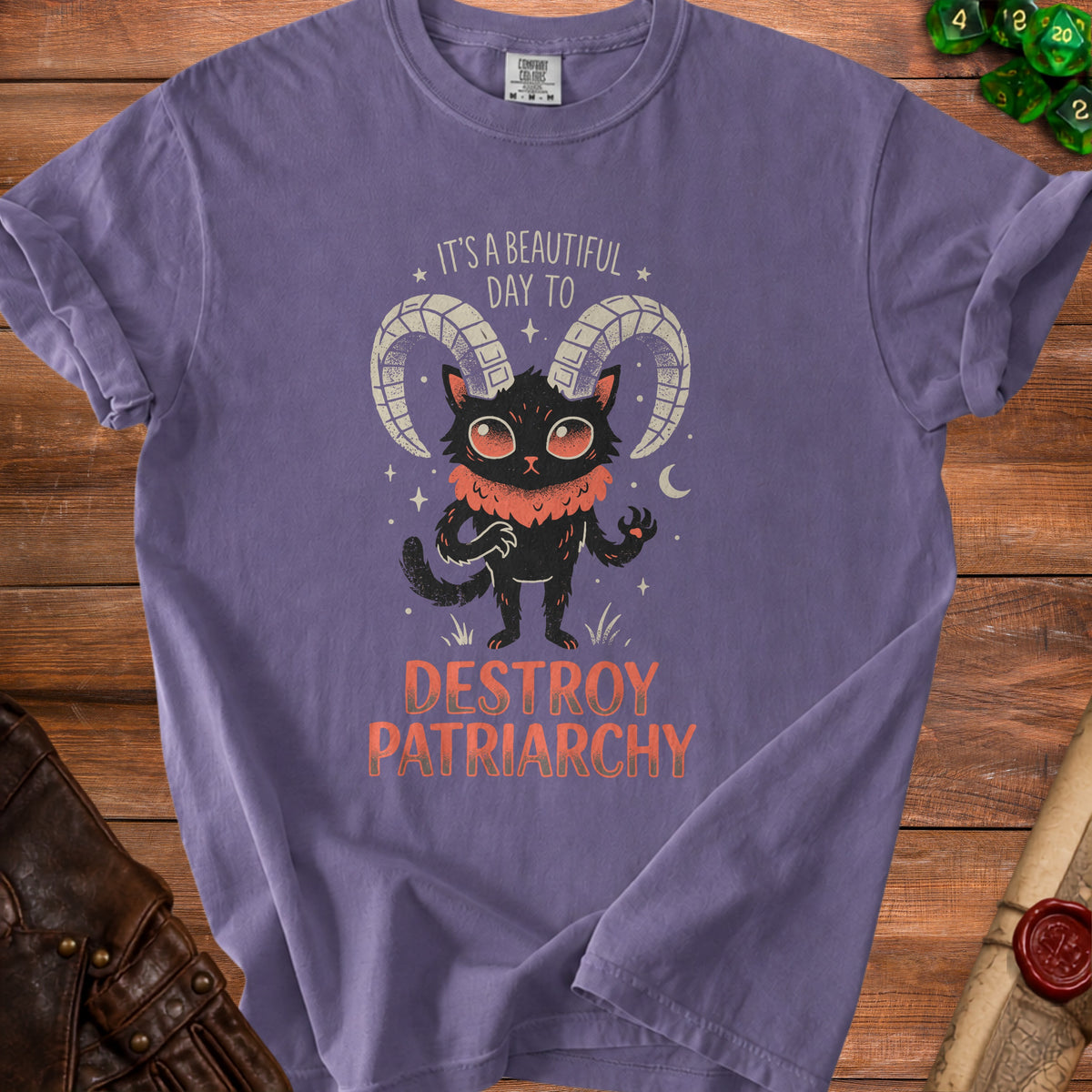 Purple t-shirt with a black cat graphic saying "It's a beautiful day to destroy patriarchy."