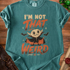Teal t-shirt with a cartoon vampire and text "I'M NOT THAT WEIRD".