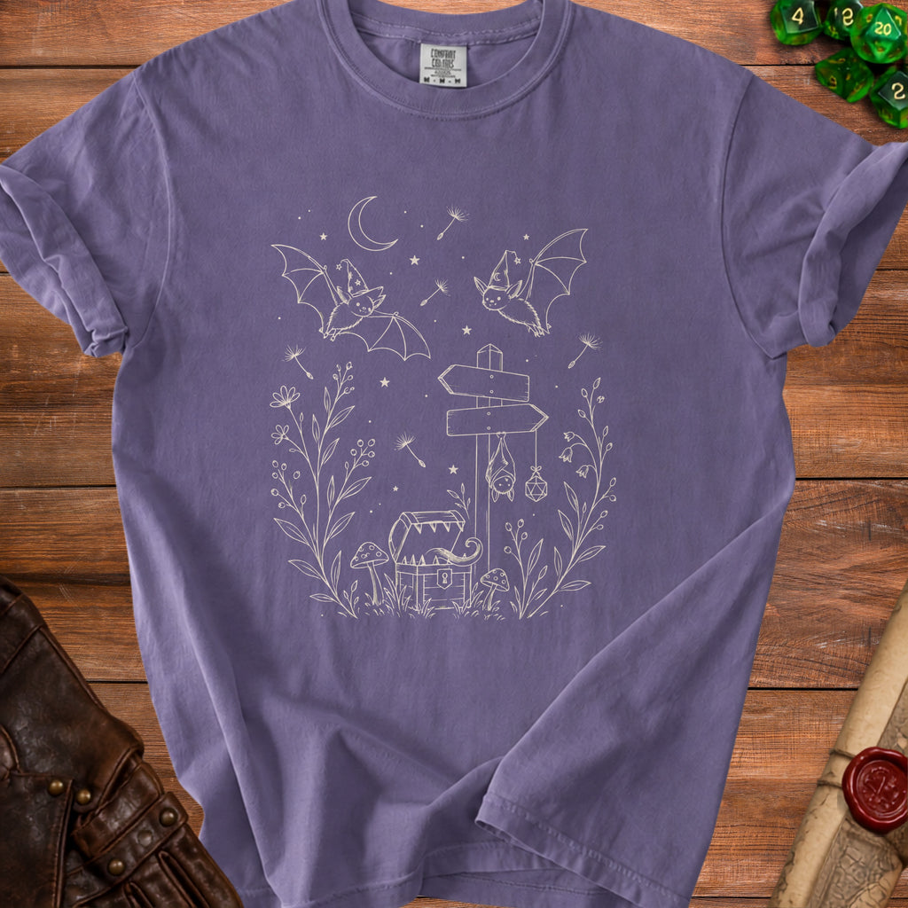 Purple t-shirt with white line art of bats, chest, mushrooms, and signpost.