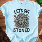 Light blue t-shirt with Medusa graphic and "Let's Get Stoned" text.