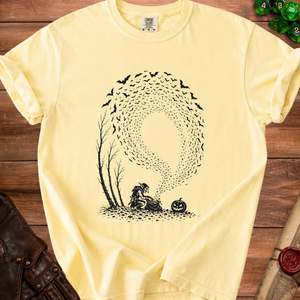 Yellow t-shirt with black graphic of a goblin pouring keys from a bag surrounded by bats and a pumpkin.