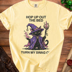 Yellow t-shirt with wizard cat graphic and text "Hop Up Out The Bed Turn My Swag O'".