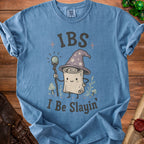 Blue t-shirt with "IBS I Be Slayin" text and wizard scroll graphic.