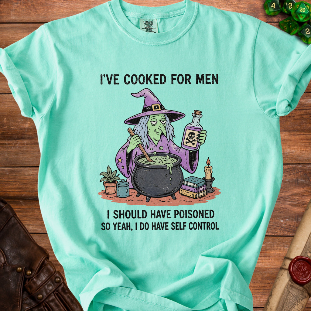 Mint green t-shirt with witch illustration and text "I'VE COOKED FOR MEN I SHOULD HAVE POISONED SO YEAH, I DO HAVE SELF CONTROL".