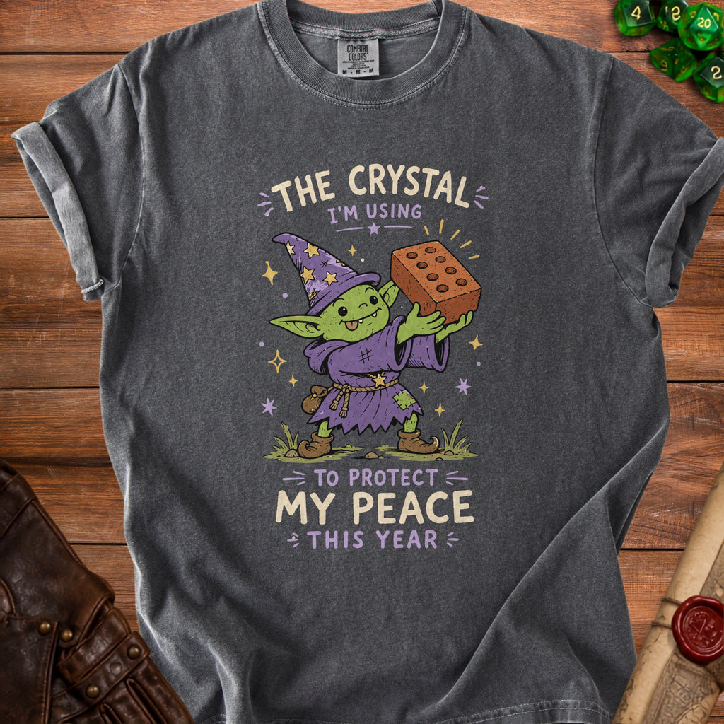 Goblin in wizard hat holding brick with text "The crystal I'm using to protect my peace this year".