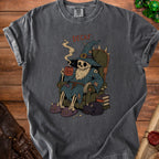 T-shirt graphic of skeleton wizard with "DECAF" text, holding "NOT A MORNING PERSON" mug.