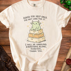 Cream t-shirt with illustration of a creature on boxes and text "Asked for help once. Did not care for it. I will be handling everything alone, forever, thank you."