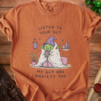 Orange t-shirt with cartoon Yoda drinking "Worry Juice" with text "Listen to Your Gut".