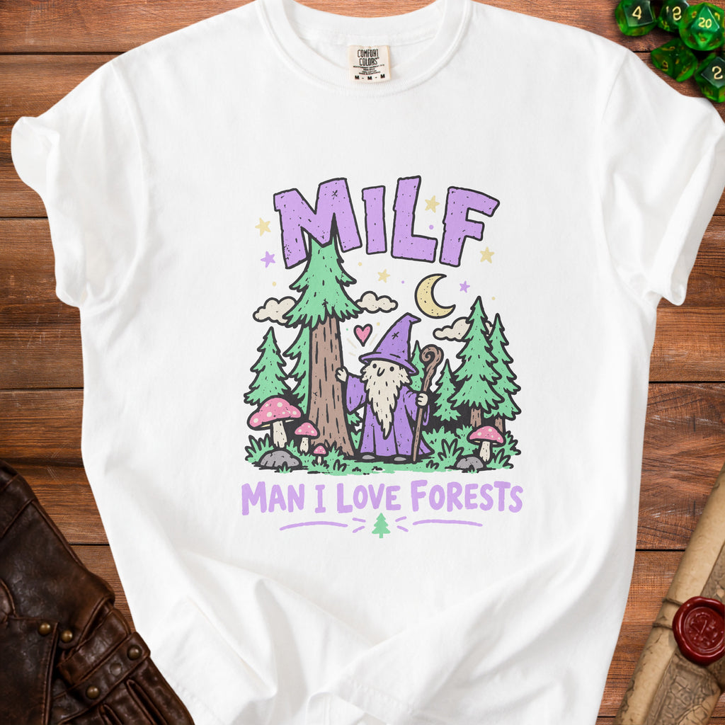 White t-shirt with cartoon wizard, trees, mushrooms, and text "MILF MAN I LOVE FORESTS".