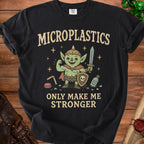 Black t-shirt with "MICROPLASTICS ONLY MAKE ME STRONGER" and a cartoon goblin.