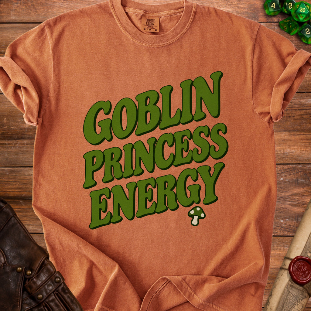 Orange t-shirt with "Goblin Princess Energy" text and a mushroom graphic.