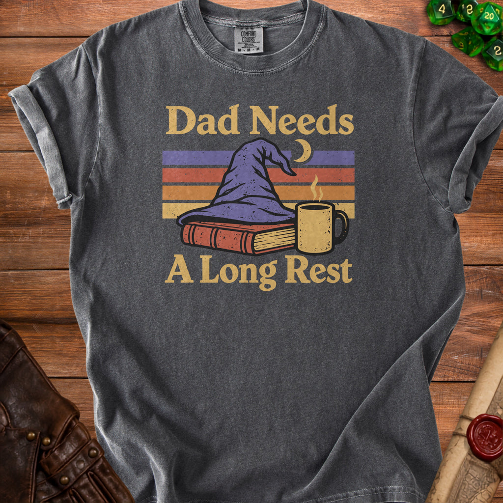 Dark gray t-shirt with "Dad Needs A Long Rest" text, wizard hat, book, and mug graphic.