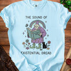 Light blue t-shirt with "The Sound of Existential Dread" graphic featuring a gnome reading.
