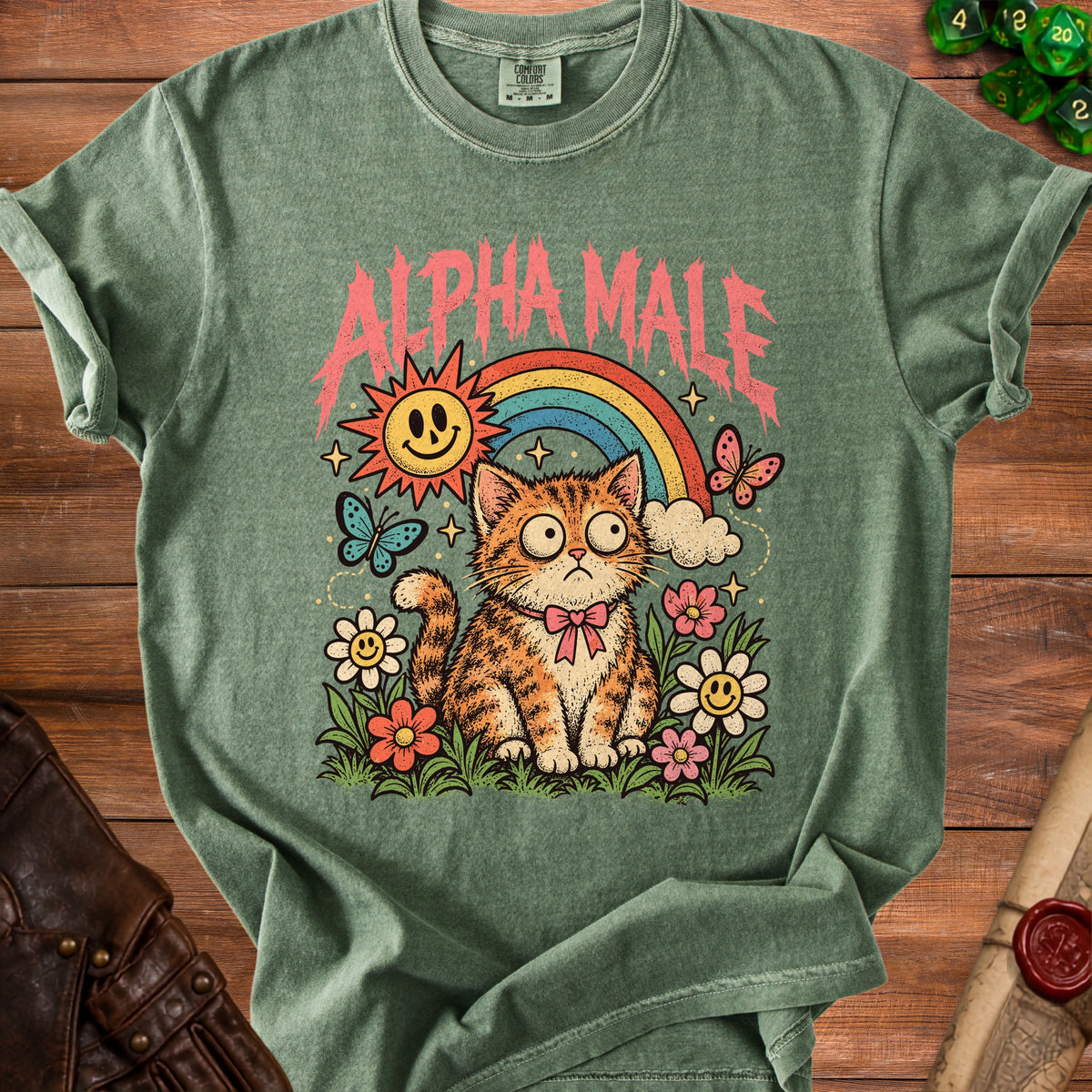 Green t-shirt with an orange tabby cat, rainbow, sun, and flowers graphic.