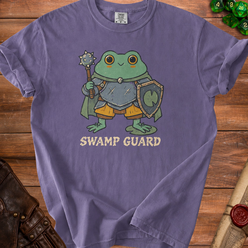 Purple t-shirt with a cartoon frog knight and the text "SWAMP GUARD".