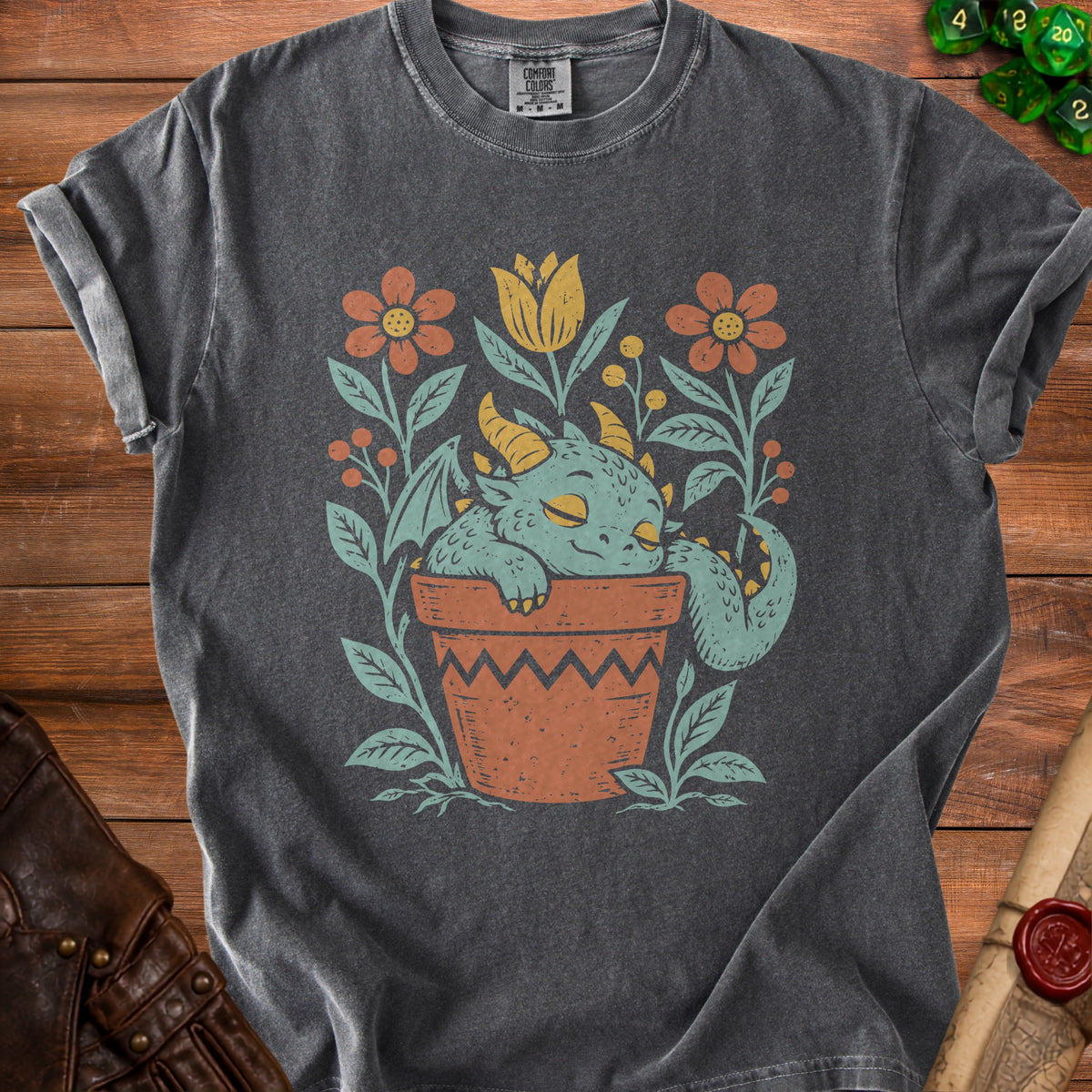 Dark gray t-shirt with a cute sleeping dragon in a flower pot graphic.