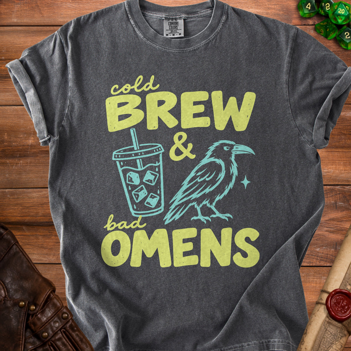 Dark t-shirt with "Cold Brew & Bad Omens" text, a coffee cup, and a raven.