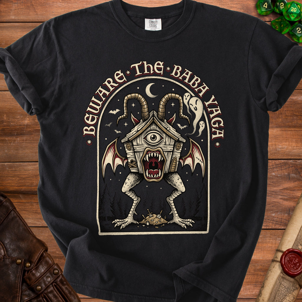 Black t-shirt with "Beware the Baba Yaga" text and a monstrous house design.