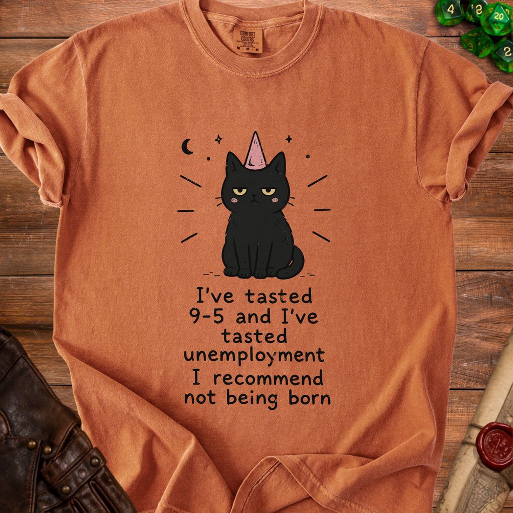 Orange t-shirt with a black cat wearing a party hat and the text "I've tasted 9-5 and I've tasted unemployment I recommend not being born."