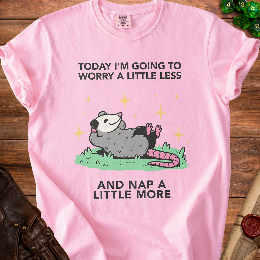 Pink t-shirt with opossum graphic and text "Today I'm going to worry a little less and nap a little more."