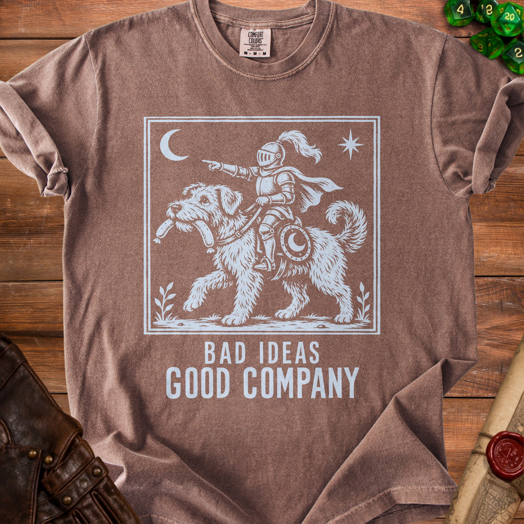 Brown t-shirt with white graphic of knight riding dog and text "Bad Ideas Good Company".