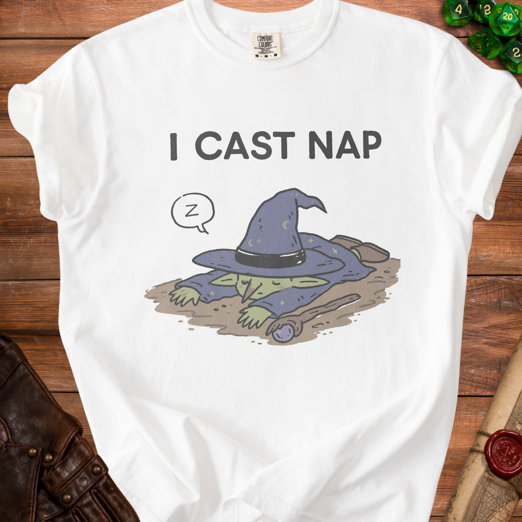 White t-shirt with a sleeping green goblin in a witch hat and "I CAST NAP" text.
