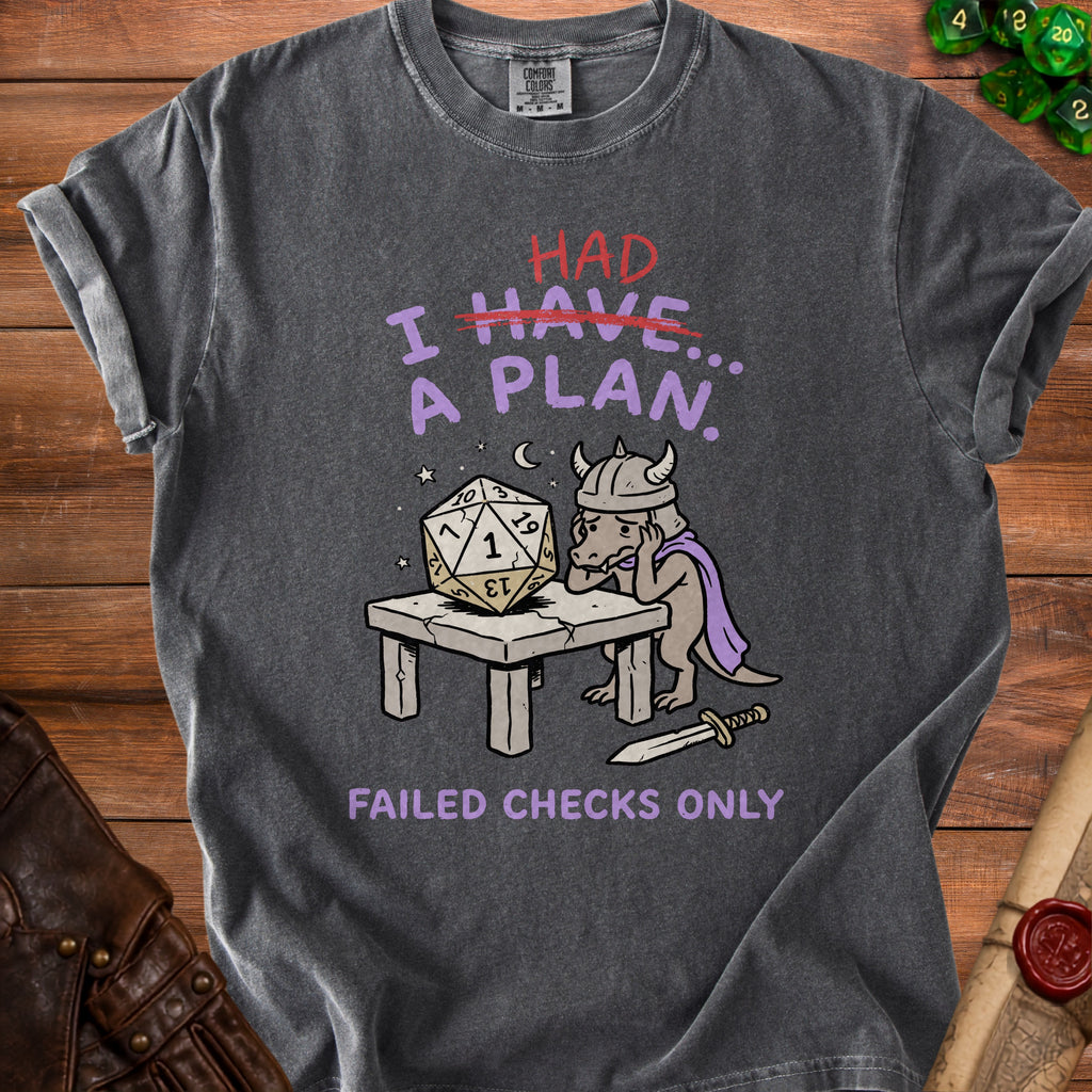 T-shirt graphic of a dragon with a large dice and text: "HAD I HAVE A PLAN. FAILED CHECKS ONLY".
