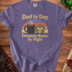 Purple t-shirt with "Dad by Day Dungeon Master by Night" text, coffee cup, and D20 die.
