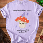 Purple t-shirt with mushroom graphic and text "plans? yeah, i have some... mostly canceling and snacks".