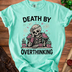 T-shirt with skeleton graphic and text "DEATH BY OVERTHINKING"