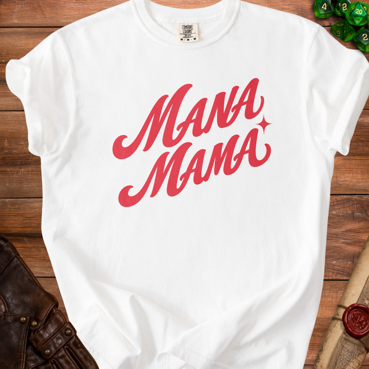 White t-shirt with red "Mana Mama" text and a small star.