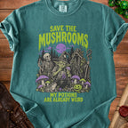 Shirt with "SAVE THE MUSHROOMS MY POTIONS ARE ALREADY WEIRD" and spooky forest graphic.