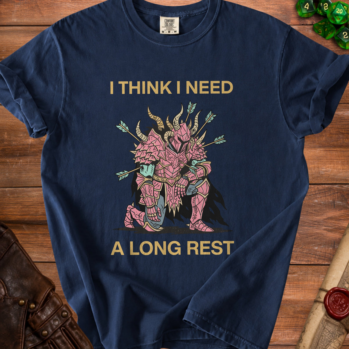 Navy t-shirt with pink knight and text "I THINK I NEED A LONG REST".