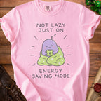 Pink t-shirt with graphic saying "NOT LAZY JUST ON ENERGY SAVING MODE"