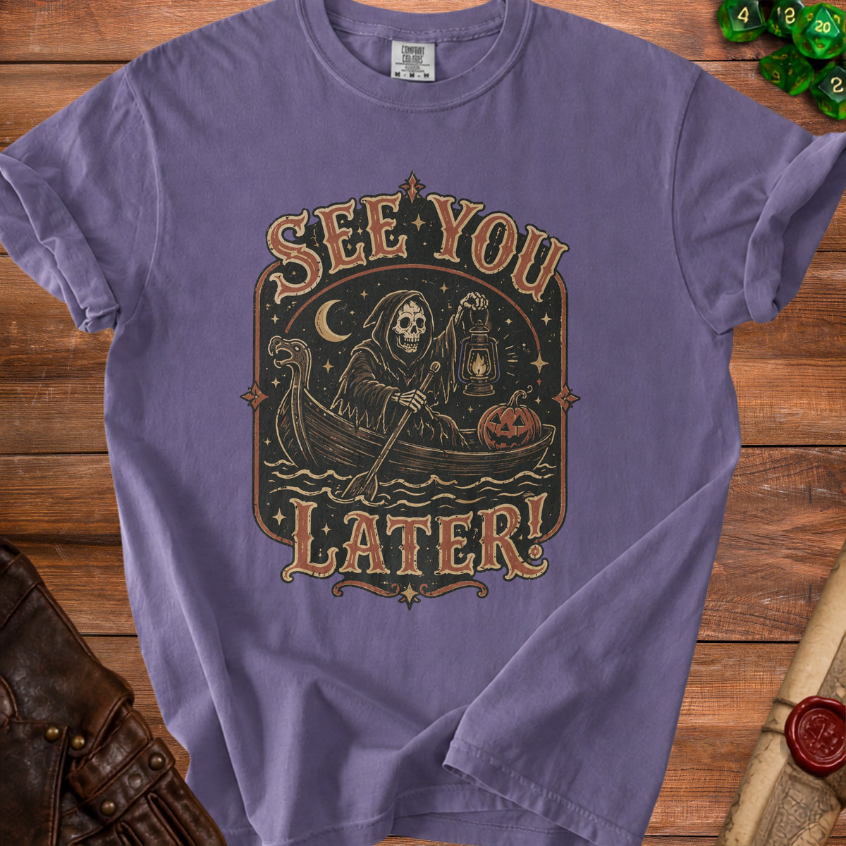 Purple t-shirt with grim reaper in a boat, pumpkin, lantern, and "See You Later!" text.