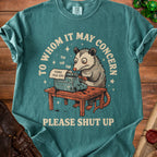 Opossum typing on a typewriter with text "To Whom It May Concern" and "Please Shut Up".