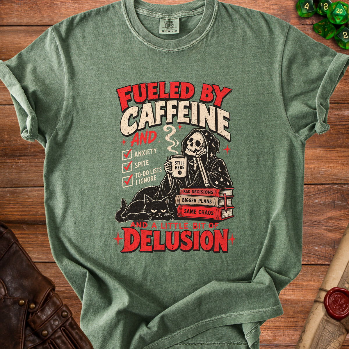 Green t-shirt with "Fueled by Caffeine, Anxiety, Spite, To-Do Lists I Ignore, and a Little Bit of Delusion" text and skeleton graphic.