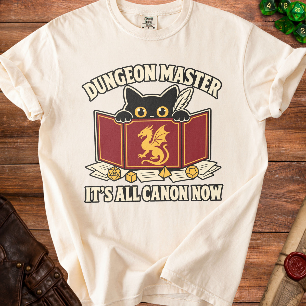 Cream t-shirt with "Dungeon Master" text, black cat, and dragon graphic.