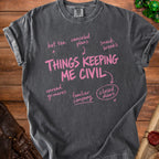 Dark grey t-shirt with pink text "Things Keeping Me Civil" and related phrases.