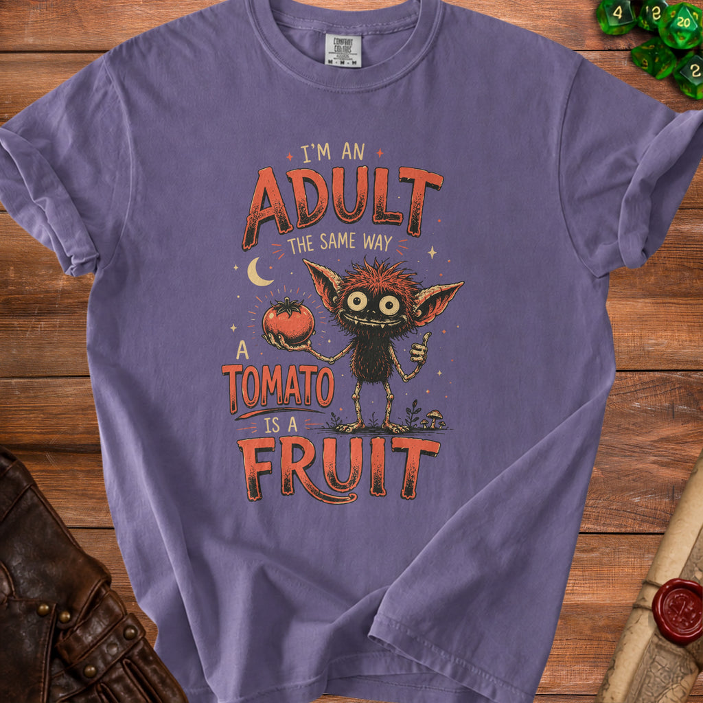 Purple t-shirt with a creature holding a tomato and text "I'M AN ADULT THE SAME WAY A TOMATO IS A FRUIT".