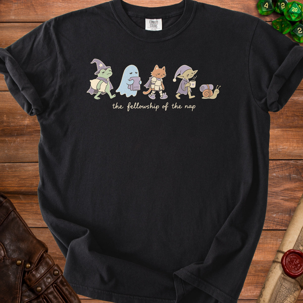 Black t-shirt with cartoon characters and text "the fellowship of the nap".