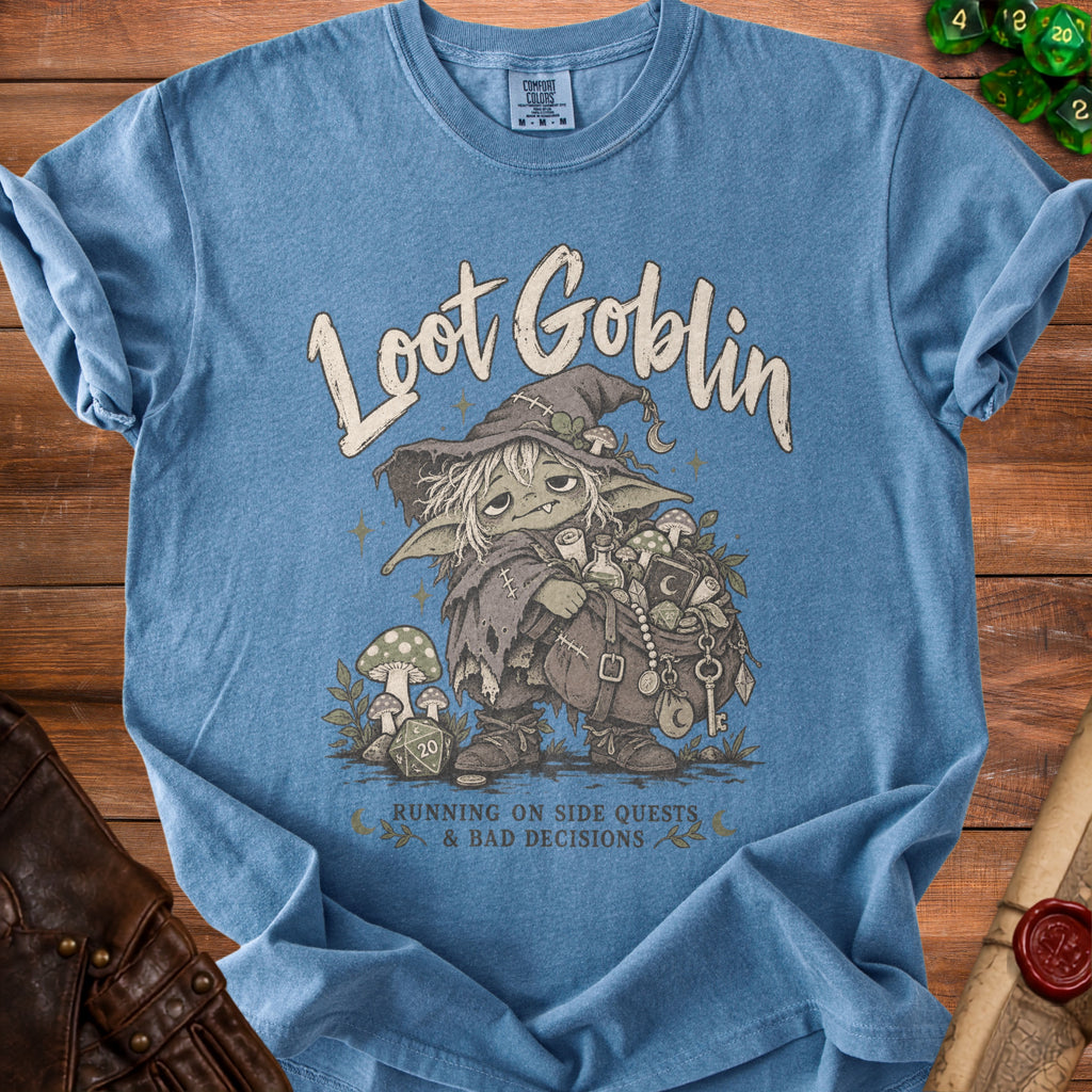 Blue t-shirt with "Loot Goblin" graphic of a goblin, dice, and potions.