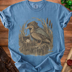 Duck wearing a cloak holding a key next to a treasure chest with a twenty-sided die.